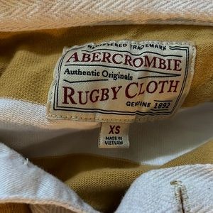 Yellow and white striped rugby shirt